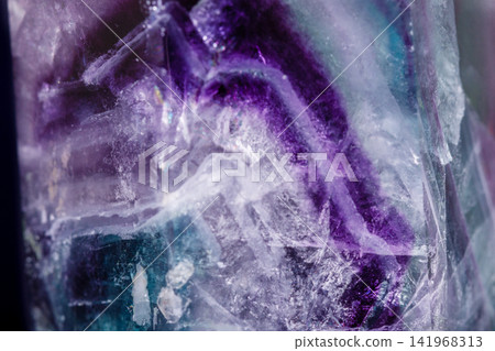 Macro mineral stone Fluorite crystal on a black background Macro mineral stone Fluorite crystal on a black background 141968313