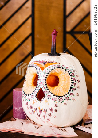 pumpkin in the form of an owl, an owl carved from a pumpkin, into a halloween pumpkin in the form of an owl, an owl carved from a pumpkin, into a halloween 141968328