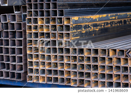 Close-Up of Rusty Square Metal Tubing Stacks 141968609