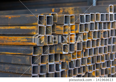 Close-Up of Rusted Square Metal Tubes in Storage Close-Up of Rusted Square Metal Tubes in Storage 141968613