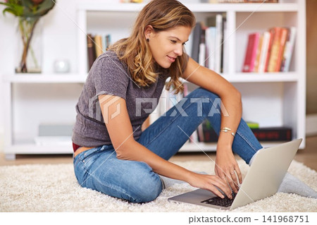 Research, streaming or girl on laptop in home to relax with internet connection for film, video or movie online. Smile, blog and happy woman on social media and technology for subscription in house Research, streaming or girl on laptop in home to relax with internet connection for film, video or movie online. Smile, blog and happy woman on social media and technology for subscription in house 141968751