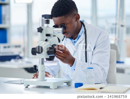 Science, notes and black man with microscope for research, investigation or medical engineering in laboratory. Biotech, lab technician or scientist checking vaccine sample for pharmaceutical test. Science, notes and black man with microscope for research, investigation or medical engineering in laboratory. Biotech, lab technician or scientist checking vaccine sample for pharmaceutical test. 141968759