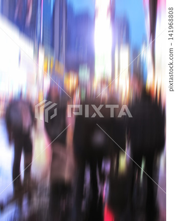 Group, walking and street with motion blur at night of busy road with lights in New York City. People, community or pedestrians on sidewalk in late evening, town square or urban area with traffic Group, walking and street with motion blur at night of busy road with lights in New York City. People, community or pedestrians on sidewalk in late evening, town square or urban area with traffic 141968808