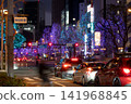 Winter in Osaka: Illuminated street trees and car taillights along Umeda Shindo. 141968845