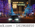 The vibrant illuminations and light trails of cars adorn the streets of Osaka. 141968850
