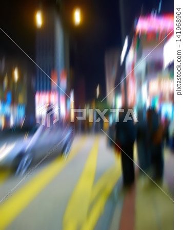 Blur, city and people on street at night outdoor in Seoul cityscape for population migration with traffic. Busy crowd, motion and road with lights, walk and travel in urban society with buildings Blur, city and people on street at night outdoor in Seoul cityscape for population migration with traffic. Busy crowd, motion and road with lights, walk and travel in urban society with buildings 141968904