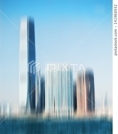 City, buildings and motion blur with skyscraper for background, architecture and urban structure. Blue sky, empty and town with daylight for travel destination, construction and development in Dubai City, buildings and motion blur with skyscraper for background, architecture and urban structure. Blue sky, empty and town with daylight for travel destination, construction and development in Dubai 141968932