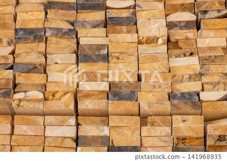 Close-Up of Stacked Rough-Cut Wooden Planks Texture Close-Up of Stacked Rough-Cut Wooden Planks Texture 141968935
