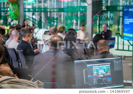 Production monitor shows live conference video feed Production monitor shows live conference video feed 141969597