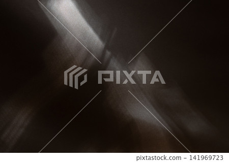 Dark Brown Fabric Background with Dramatic Light Beams and Soft Shadows. Luxury Abstract Texture. Dark Brown Fabric Background with Dramatic Light Beams and Soft Shadows. Luxury Abstract Texture. 141969723