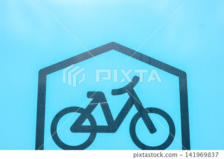 Minimal bicycle parking sign on blue surface Minimal bicycle parking sign on blue surface 141969837