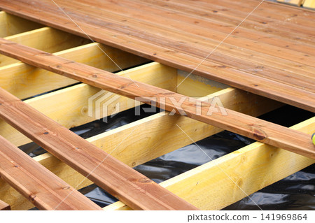 Unfinished wooden floor construction, half done construction surface Unfinished wooden floor construction, half done construction surface 141969864