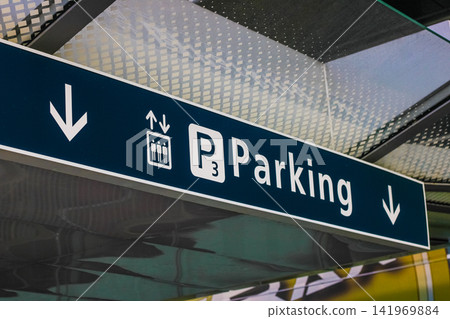 Parking level sign with arrows in airport 141969884