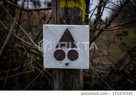 Bike path sign on the tree in the forest, Europe Bike path sign on the tree in the forest, Europe 141970345