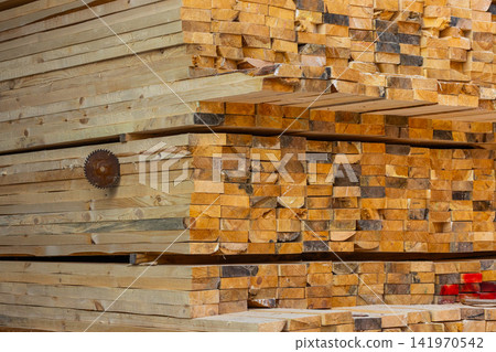 Close-Up of Stacked Lumber with Circular Saw Blade Close-Up of Stacked Lumber with Circular Saw Blade 141970542