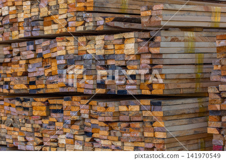 Stacked Lumber Wood Planks in Outdoor Storage Stacked Lumber Wood Planks in Outdoor Storage 141970549