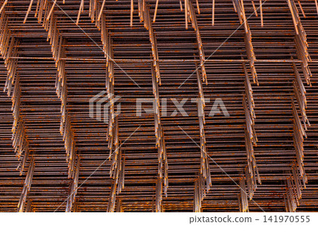 Close-Up of Rusty Rebar Mesh with Textured Surface Close-Up of Rusty Rebar Mesh with Textured Surface 141970555