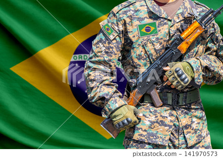 Brazil flag with soldier holding assault rifle Brazil flag with soldier holding assault rifle 141970573