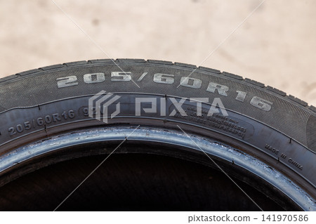 Close-up of Car Tire Sidewall with Specifications Close-up of Car Tire Sidewall with Specifications 141970586