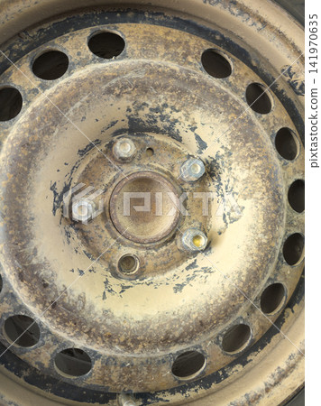 Close-up of Weathered Vehicle Wheel Rim with Missing Lug Nuts Close-up of Weathered Vehicle Wheel Rim with Missing Lug Nuts 141970635