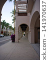 Sunlit Archway Corridor With Palm Tree View 141970637