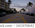 Coastal Road With Palm Trees At Golden Sunset 141970642