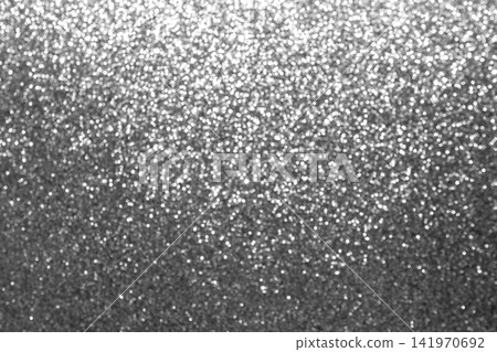 Silver glitter bokeh background with sparkling texture and metallic shine for festive designs Silver glitter bokeh background with sparkling texture and metallic shine for festive designs 141970692