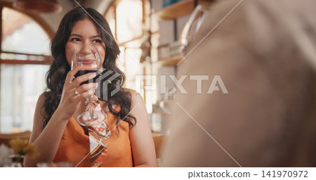 Wine, couple and woman in restaurant for date, bonding and celebrate anniversary together. Happy, glass and people with drinks for romance, relationship and listening for connection with love 141970972
