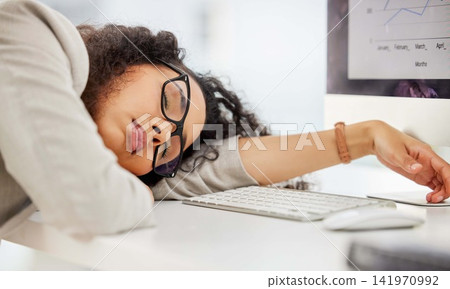 Burnout, fatigue or sleep and business woman on desk in office, exhausted from data analysis deadline. sleeping, stock market and tired employee lying on table in workplace for finance management 141970992