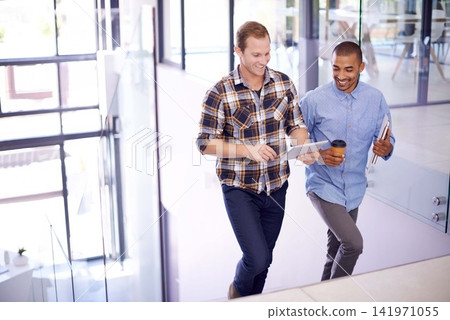 Men, office and happy with tablet on stairs for online research, ideas and creativity as graphic designers. People, teamwork and together on internet for networking, communication and discussion Men, office and happy with tablet on stairs for online research, ideas and creativity as graphic designers. People, teamwork and together on internet for networking, communication and discussion 141971055