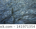 View of textured rock surface with blue and gray hues Emerald slate close up 141971354