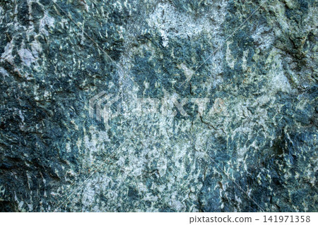 Close-up view of textured shale rock surface with natural patterns and colors 141971358