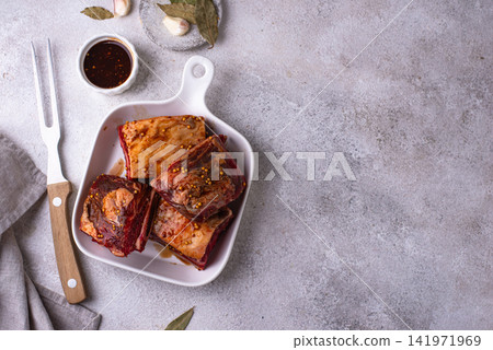 Raw unkooked lamb ribs for barbecue Raw unkooked lamb ribs for barbecue 141971969