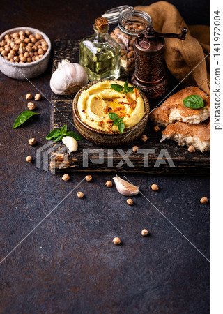 Traditional hummus with chickpeas, paprika, olive oil Traditional hummus with chickpeas, paprika, olive oil 141972004