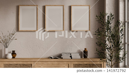 Three Blank Wood Frame Wall Art Mockup in Modern Minimalist Living Room Interior with Sideboard and Plant Three Blank Wood Frame Wall Art Mockup in Modern Minimalist Living Room Interior with Sideboard and Plant 141972792