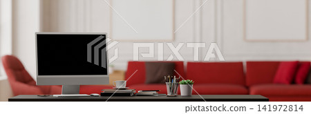 3D Illustration of Modern Office Desk with Blank Monitor Screen and Wall Art Frames in Stylish Interior 141972814
