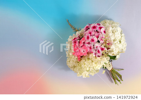 Bouquet of various varieties of phlox and garden hydrangea on a bright sunny background, an advertising banner for summer and autumn products, an abstract floral arrangement, flat lay still life, Bouquet of various varieties of phlox and garden hydrangea on a bright sunny background, an advertising banner for summer and autumn products, an abstract floral arrangement, flat lay still life, 141972924