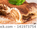 Delicious tiramisu dessert with cocoa powder top 141973754