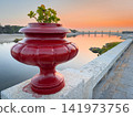 Red vase on promenade in Vila Praia de Ancora 141973756