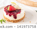 Delicious mini cheesecake with berry jam and lemon 141973758