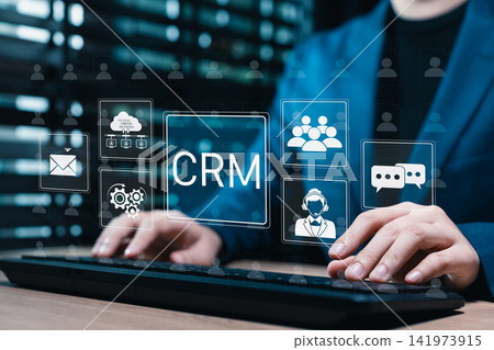 Customer relationship management system. Businesswoman using CRM software to organize client data, automate communication, support service teams, manage contacts, and improve sales workflow efficiency 141973915