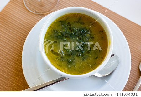 Caldo verde served in bowl on table Caldo verde served in bowl on table 141974031