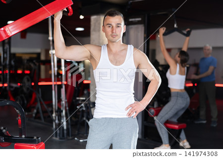 Young athletic man posing in gym 141974308