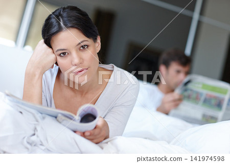 Woman, thinking and portrait with magazine and boyfriend for contemplate future with article for rest in home. Mexican female person or girlfriend with book and idea thoughts with partner in bed Woman, thinking and portrait with magazine and boyfriend for contemplate future with article for rest in home. Mexican female person or girlfriend with book and idea thoughts with partner in bed 141974598
