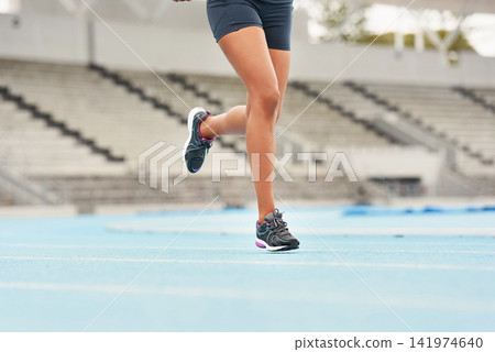 Runner, track and woman athlete on legs, fitness and outdoor exercise for sports competition. Race, stadium position and field cardio event for female person, workout and sprint for fast training Runner, track and woman athlete on legs, fitness and outdoor exercise for sports competition. Race, stadium position and field cardio event for female person, workout and sprint for fast training 141974640