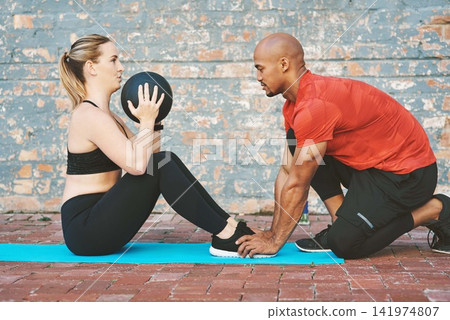 Ball, fitness and coach with woman for workout, exercise and on yoga mat for sport. Partnership, personal trainer and athlete on break by brick wall at gym for wellness, training or healthy lifestyle Ball, fitness and coach with woman for workout, exercise and on yoga mat for sport. Partnership, personal trainer and athlete on break by brick wall at gym for wellness, training or healthy lifestyle 141974807