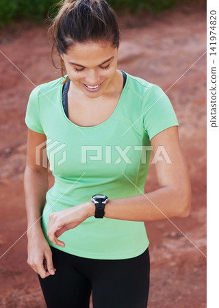 Woman, fitness and check smart watch in nature for workout goals, running and cardio results. Sports person or runner check timer or stopwatch for exercise, training and health progress in forest Woman, fitness and check smart watch in nature for workout goals, running and cardio results. Sports person or runner check timer or stopwatch for exercise, training and health progress in forest 141974820