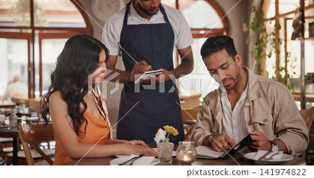 Server, menu and couple in restaurant for date, connection or bonding on weekend together. Discussion, food and waiter with man and woman for decision on dinner, meal or supper order in diner. Server, menu and couple in restaurant for date, connection or bonding on weekend together. Discussion, food and waiter with man and woman for decision on dinner, meal or supper order in diner. 141974822