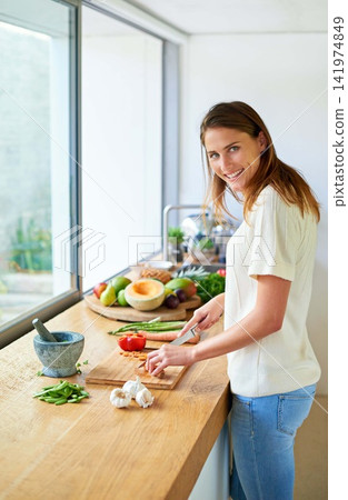 Portrait, home and woman with vegetables, cutting and smile with vegan, healthy meal and nutrition. Face, vegetarian and person in kitchen, food and chef with skills, cooking and organic ingredients Portrait, home and woman with vegetables, cutting and smile with vegan, healthy meal and nutrition. Face, vegetarian and person in kitchen, food and chef with skills, cooking and organic ingredients 141974849