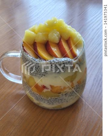 Creamy chia pudding topped with juicy plum slices, offering a smooth texture and naturally sweet, fruity contrast. Fresh, wholesome, and visually calming, perfect for healthy breakfast or dessert Creamy chia pudding topped with juicy plum slices, offering a smooth texture and naturally sweet, fruity contrast. Fresh, wholesome, and visually calming, perfect for healthy breakfast or dessert 141975341
